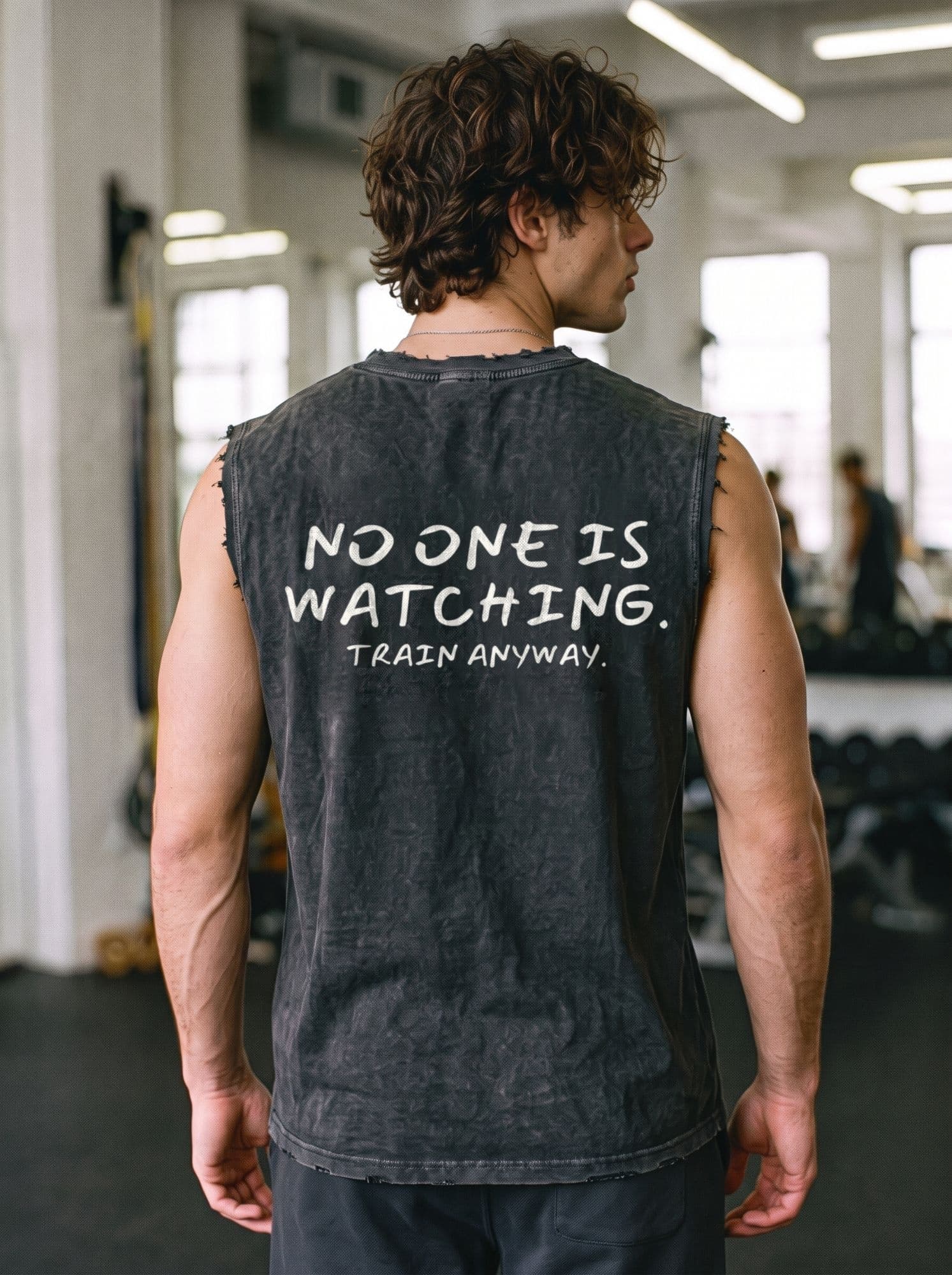 Back of the tank top reading “No one is watching. Train anyway.”